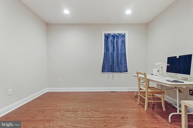 home office featuring hardwood / wood-style floors