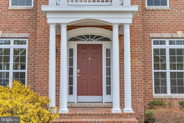 entrance to property with brick siding