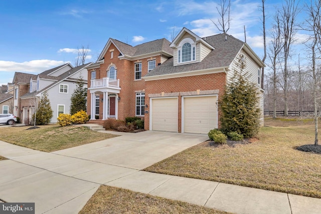 view of front of house with driveway, brick siding, a front lawn, and a balcony