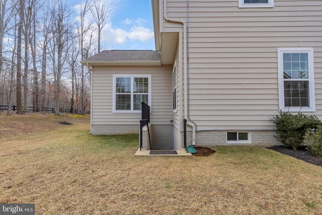 view of home's exterior with a yard