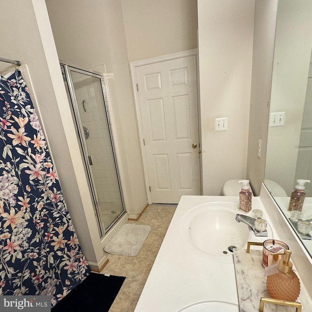 bathroom with an enclosed shower and vanity