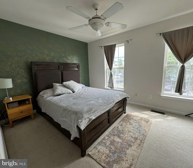 carpeted bedroom with ceiling fan