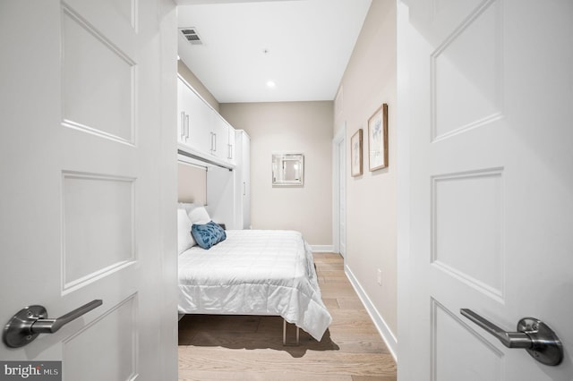 bedroom with light wood-type flooring