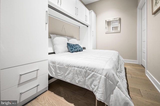 bedroom with light hardwood / wood-style flooring