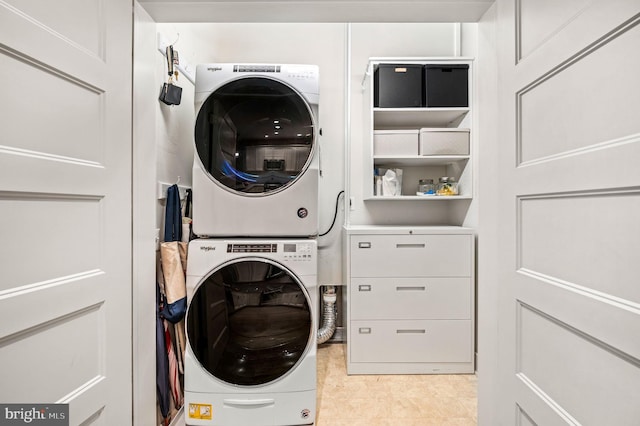 laundry area with stacked washer and dryer