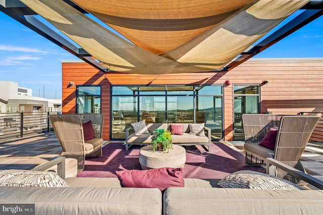 view of patio featuring a balcony and outdoor lounge area