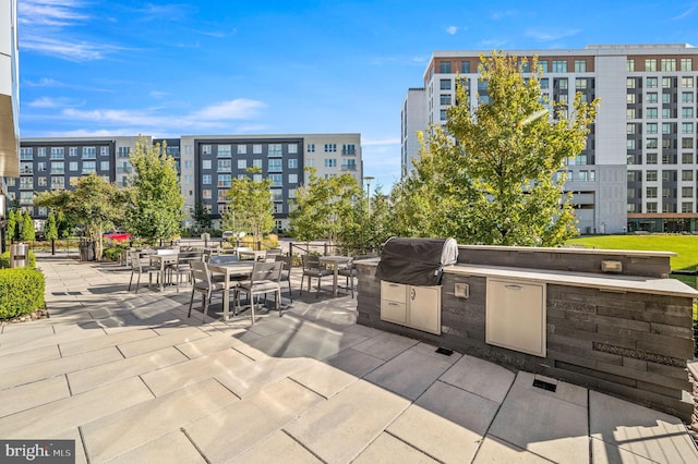 view of patio featuring an outdoor kitchen and area for grilling