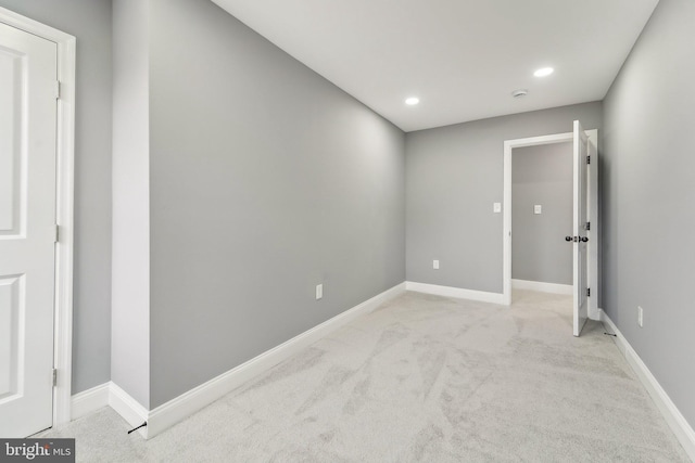 empty room with light colored carpet