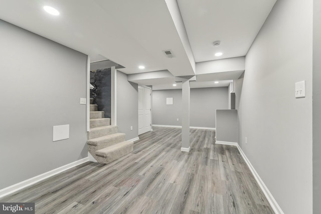 basement featuring light wood-type flooring