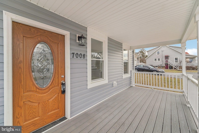 doorway to property featuring a porch