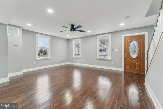 foyer entrance featuring ceiling fan and dark hardwood / wood-style flooring