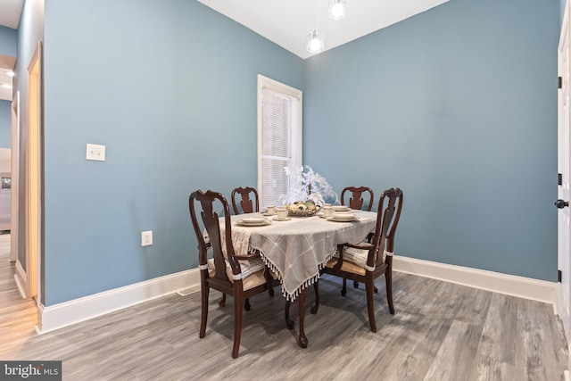 dining area featuring wood-type flooring