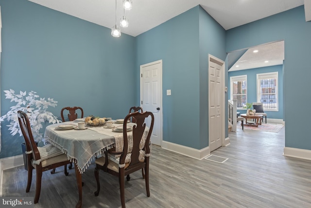 dining room with hardwood / wood-style flooring