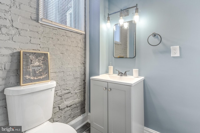 bathroom with toilet and vanity