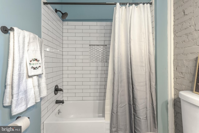 bathroom featuring toilet and shower / bath combo