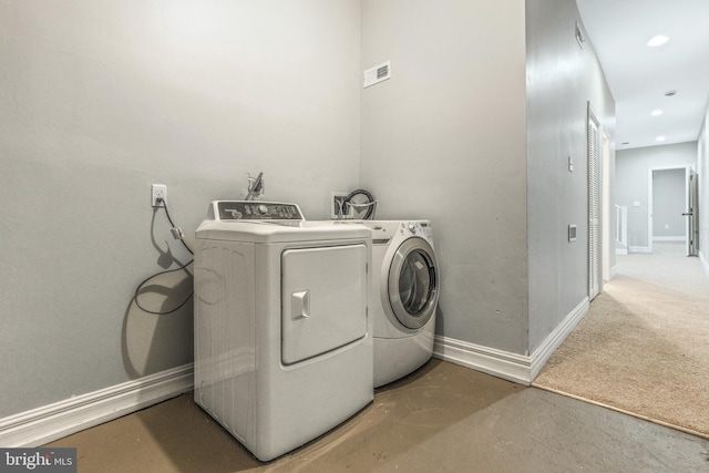 washroom with separate washer and dryer and carpet