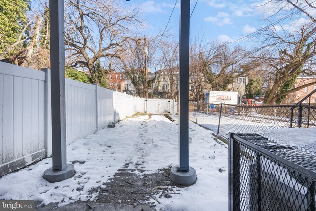 view of yard covered in snow