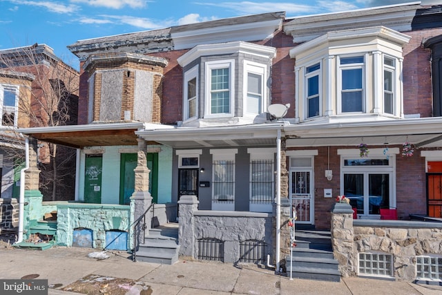 multi unit property featuring a porch