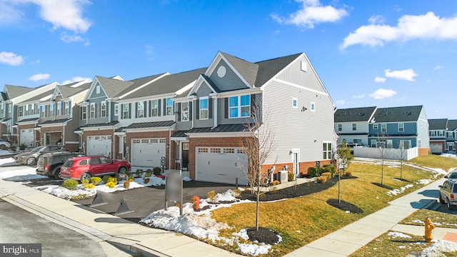 townhome / multi-family property with cooling unit, a garage, and a front yard