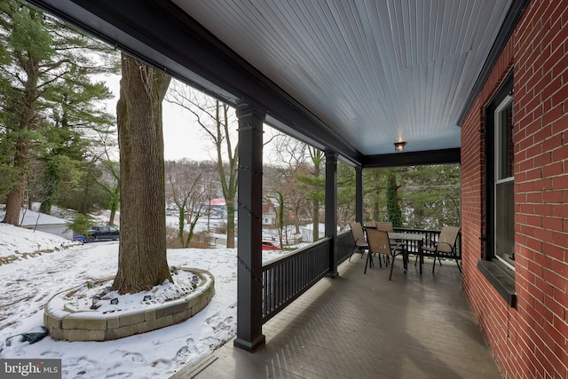 view of snow covered deck