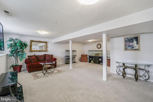 living area featuring a textured ceiling, carpet flooring, and visible vents