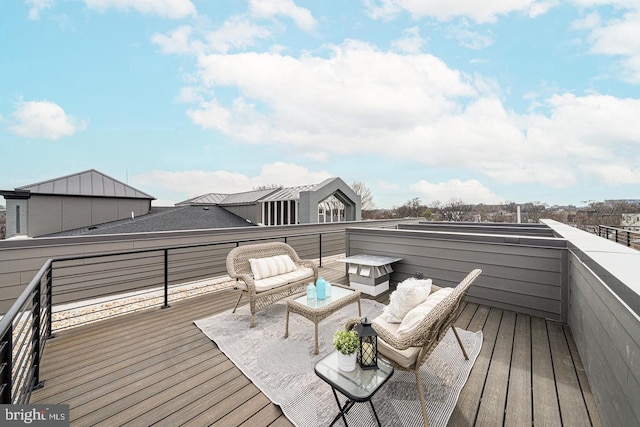 wooden terrace featuring an outdoor hangout area