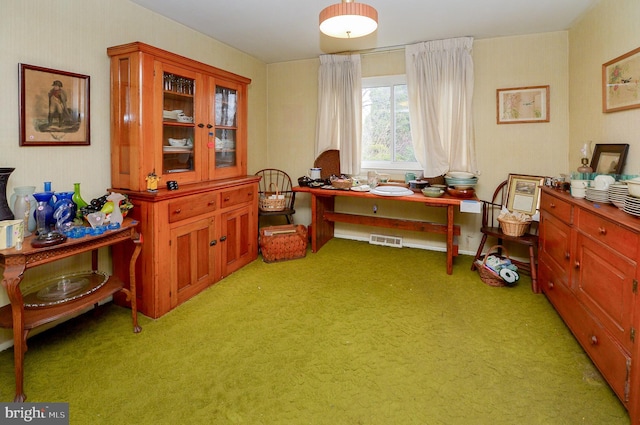 miscellaneous room featuring light colored carpet