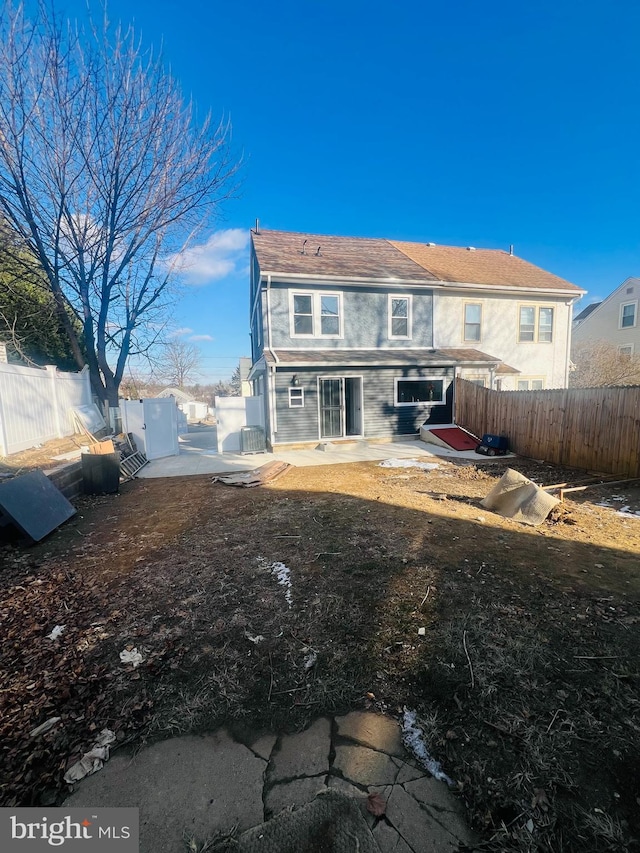 back of house with a patio