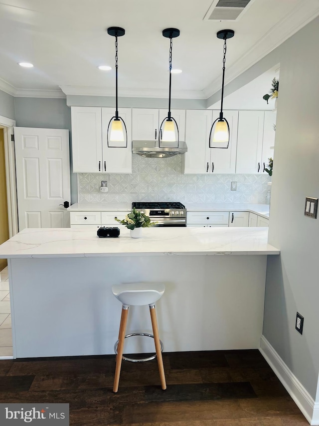 kitchen with white cabinetry, stainless steel range oven, light stone counters, kitchen peninsula, and pendant lighting