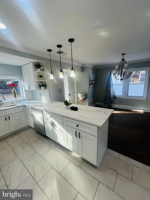 kitchen featuring kitchen peninsula, white cabinets, dishwasher, and a chandelier