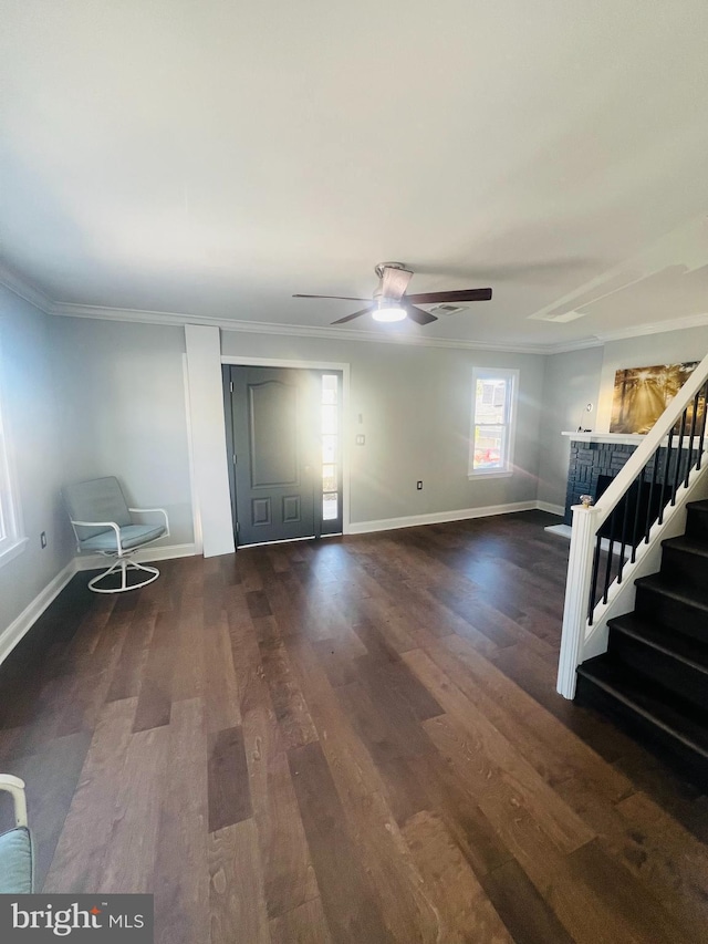 interior space featuring ceiling fan, ornamental molding, and dark hardwood / wood-style floors