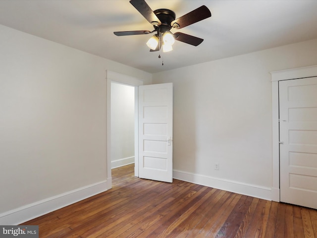 empty room featuring wood-type flooring and ceiling fan