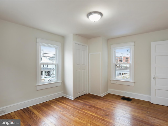 unfurnished bedroom with light wood-type flooring