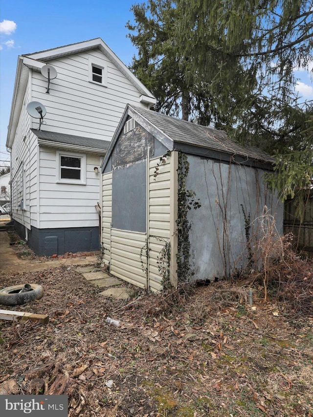 view of home's exterior featuring a shed