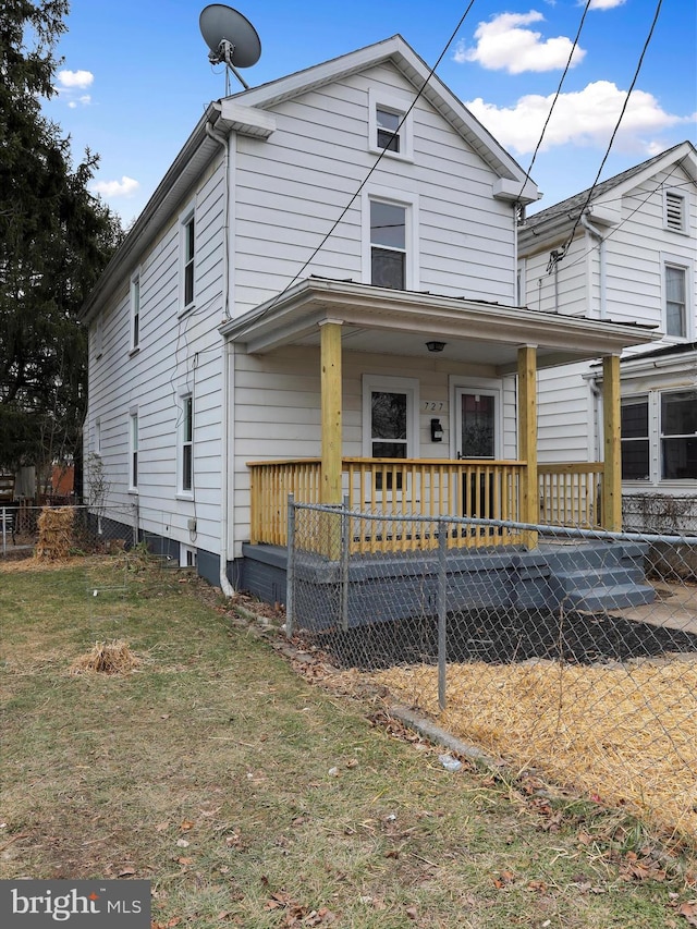 view of front of property with a front lawn and a porch