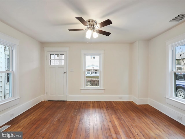 entryway with ceiling fan, hardwood / wood-style flooring, and a healthy amount of sunlight