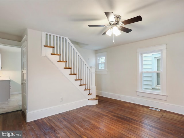 interior space with dark hardwood / wood-style floors and ceiling fan