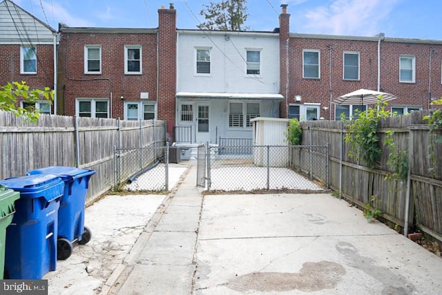 back of property with a patio