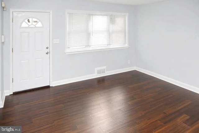 foyer with dark hardwood / wood-style flooring