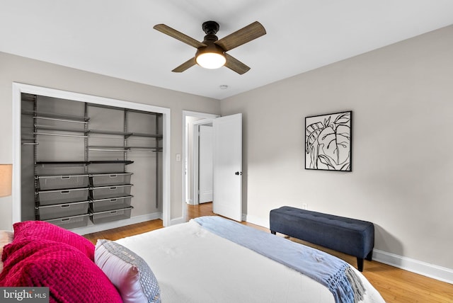 bedroom featuring hardwood / wood-style floors, a closet, and ceiling fan