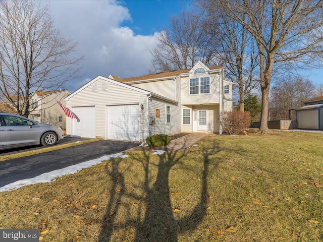 front facade with a garage and a front lawn