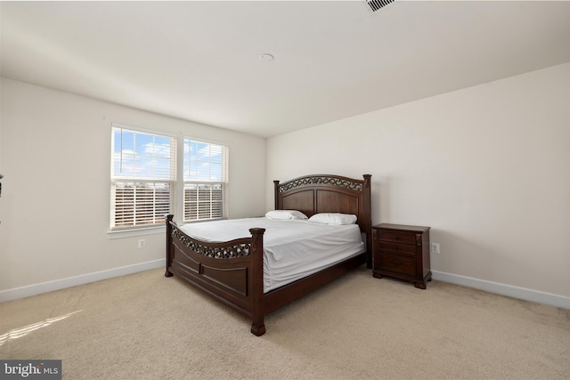 bedroom featuring light carpet