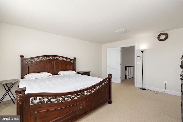 bedroom featuring light colored carpet