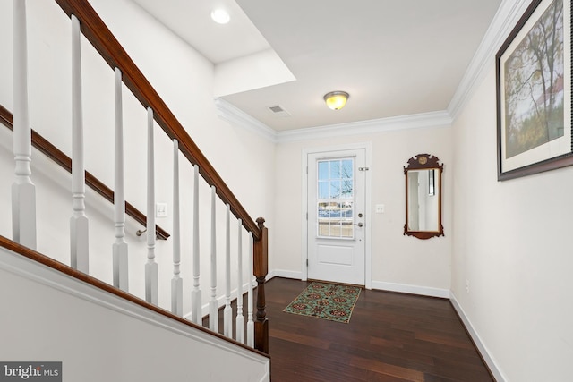 foyer with crown molding and dark hardwood / wood-style floors