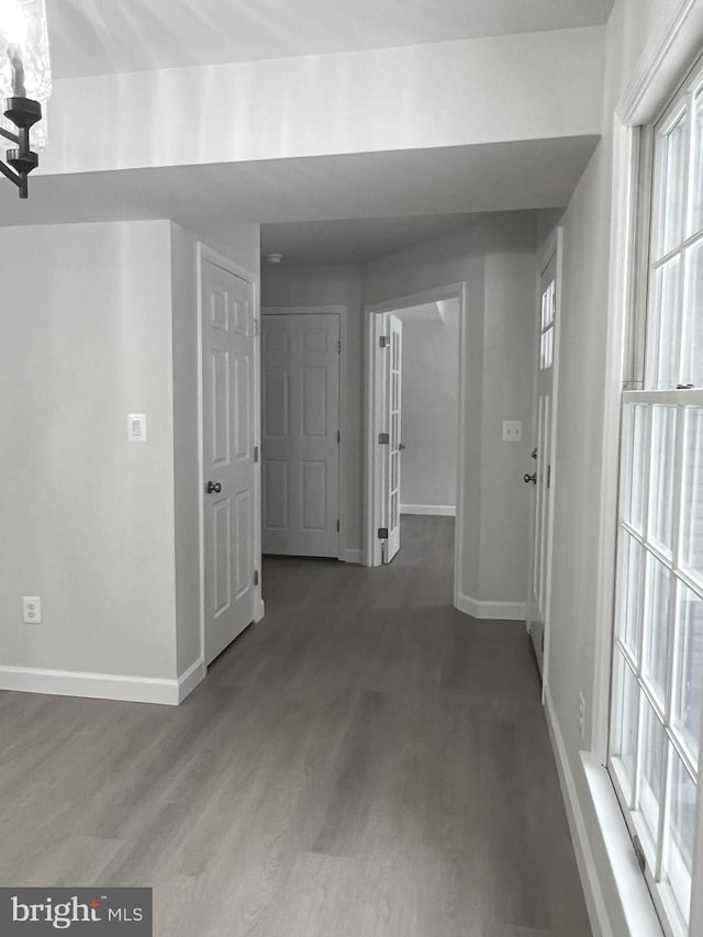 hallway with wood-type flooring