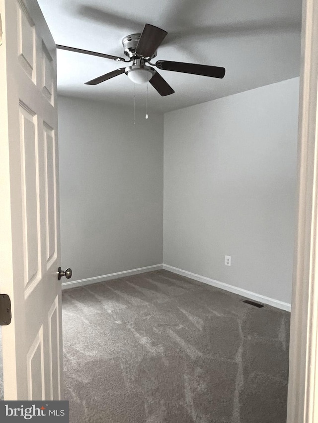 carpeted empty room with ceiling fan