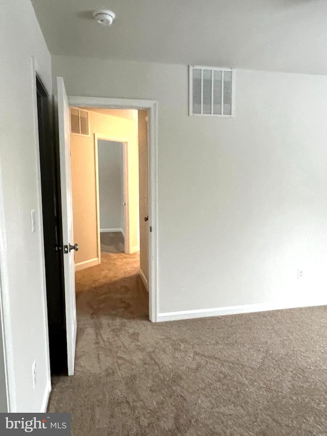 corridor featuring carpet floors