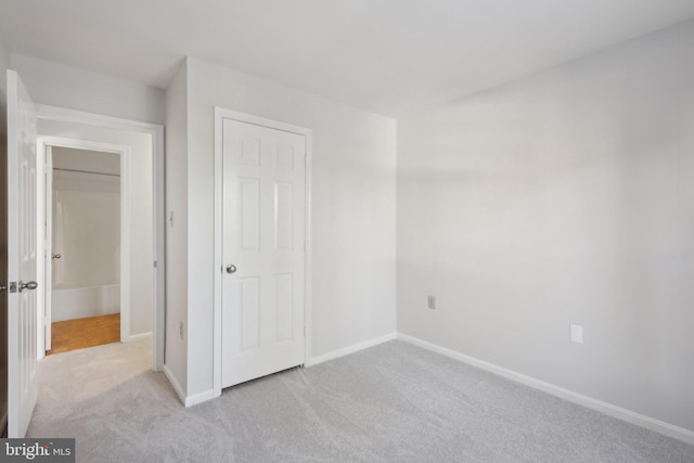 unfurnished bedroom with light carpet