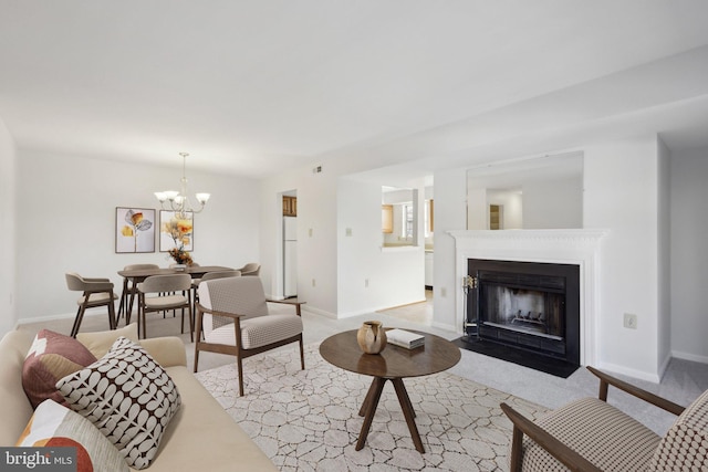 living room featuring light colored carpet and a chandelier