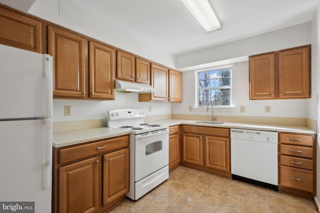 kitchen featuring sink and white appliances